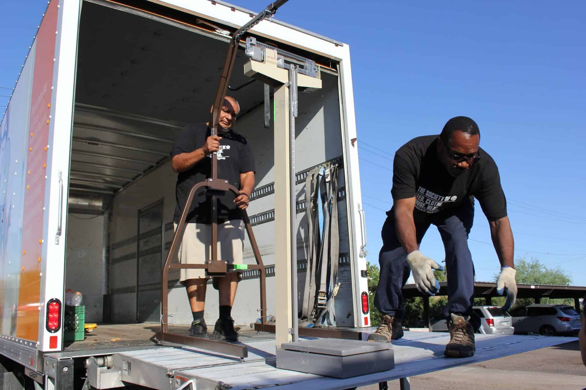 Esperança Shipment Day Volunteers Pack/Load Medical Supplies for